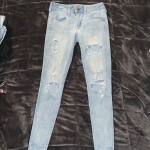 Light blue ripped American Eagle jeans.